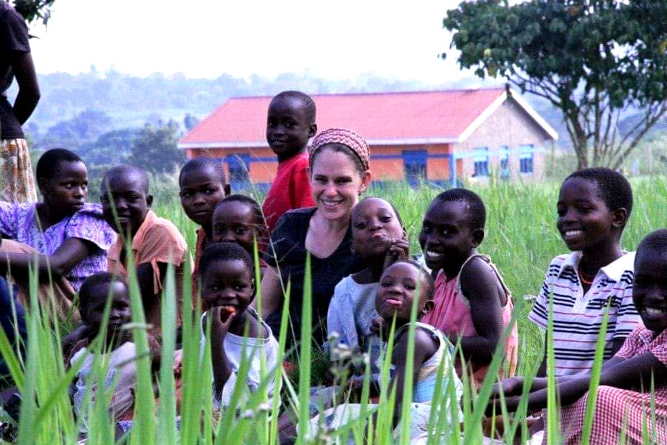 Marsha with children in Uganda