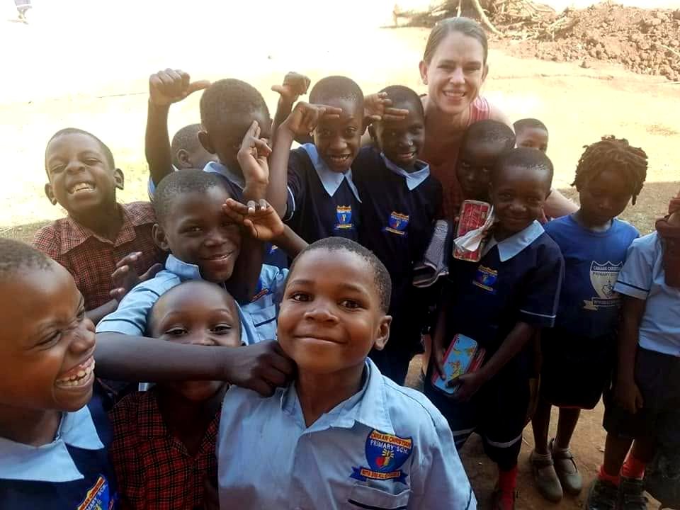 Marsha with schoolchildren in Uganda
